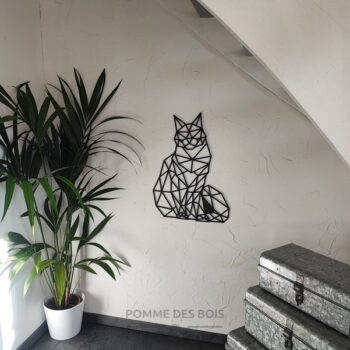 Un chat de race persan qui est assis en origami.