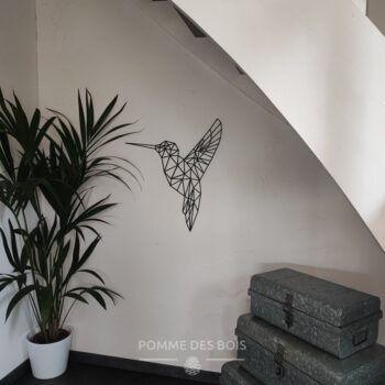 Un colibri de profil en origami.