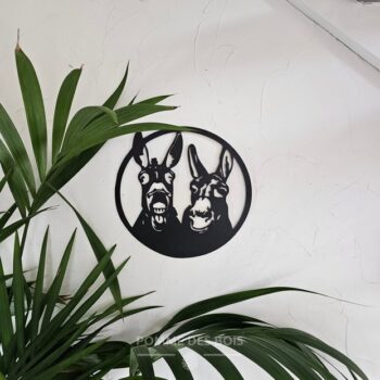 Deux ânes qui sont dans un cadre rond.